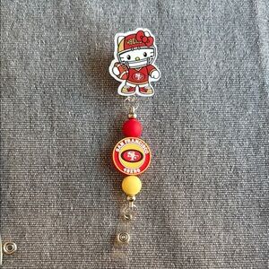 Hello Kitty San Francisco 49ers Red and Yellow Badge Reel